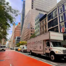Professional movers carefully handling furniture during home relocation